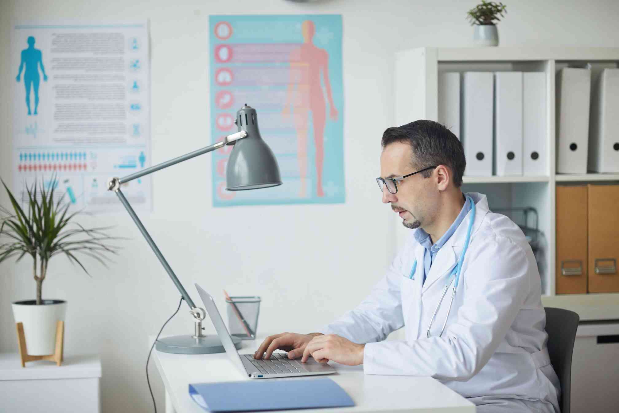 A focused healthcare professional working in a modern clinical setting.